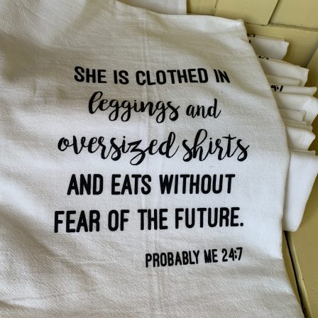 She is clothed in leggings and oversized t shirts and eats without fear of the future - dish towel
