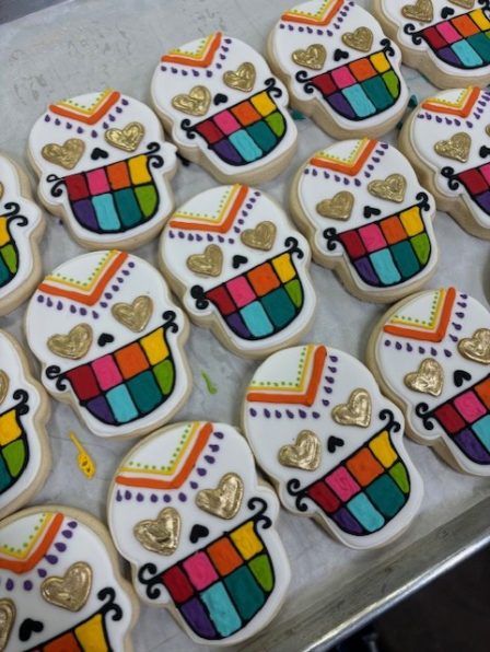 Rainbow teeth sugar skull cookie