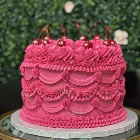 cherry topped vintage heart cake