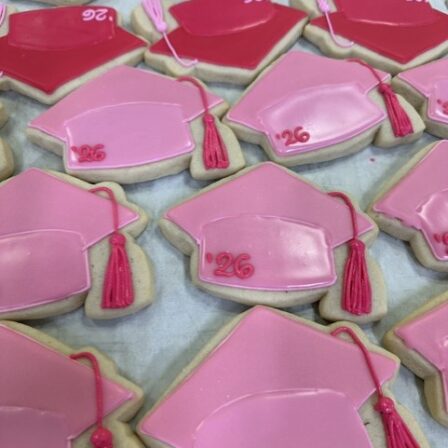Light pink grad cap cookie